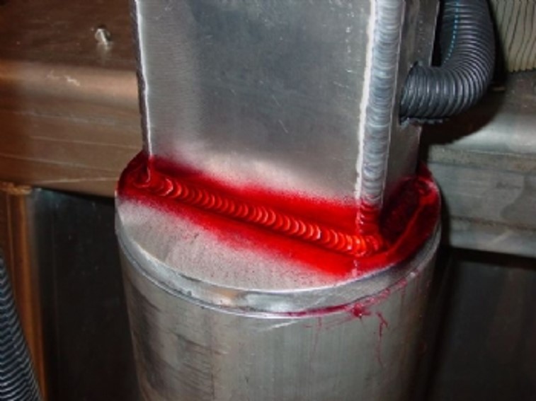 Visible liquid penetrant inspection on aluminum part
